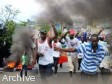 Haiti - Politic : The protesters crossing safety barriers of the National Palace